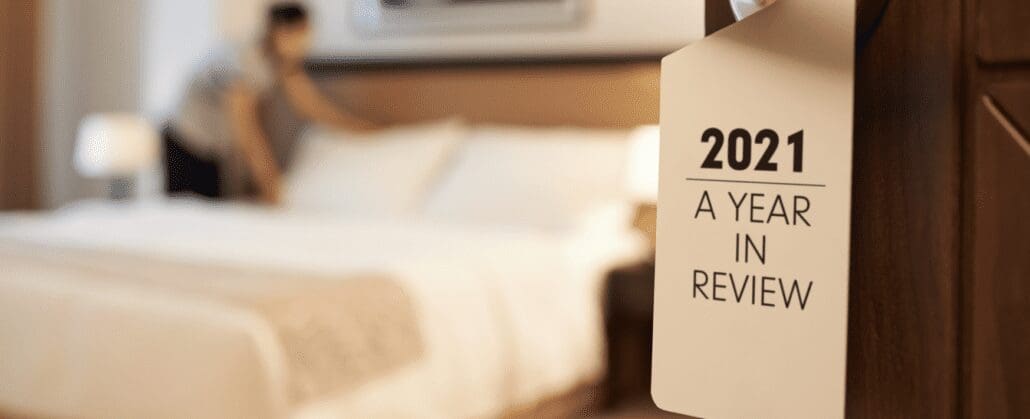 A hotel room with a door tag that says "2021 A Year In Review"