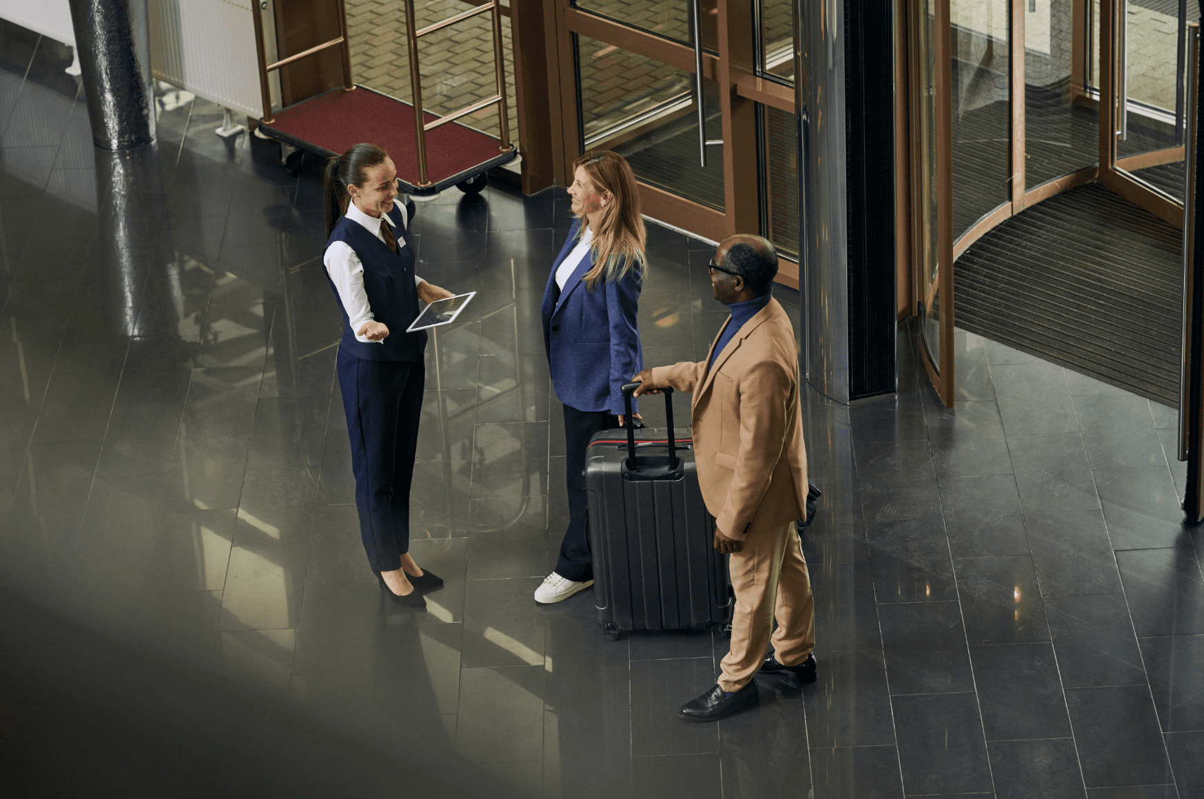 Manager meeting guests in the hotel.