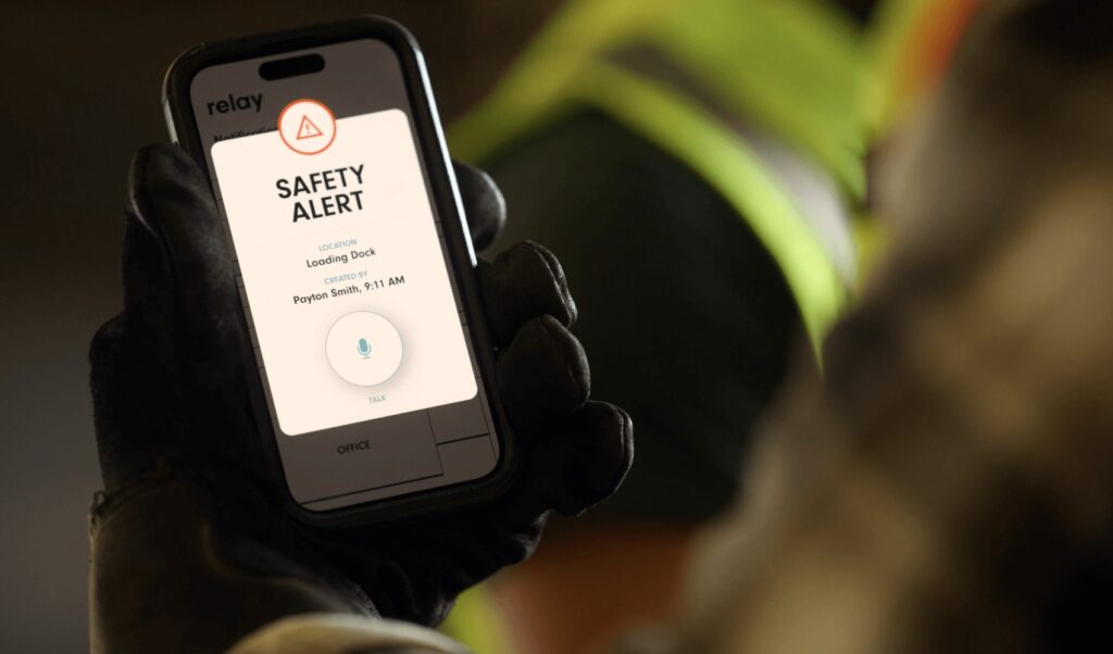 A Manufacturing worker receiving a safety alert