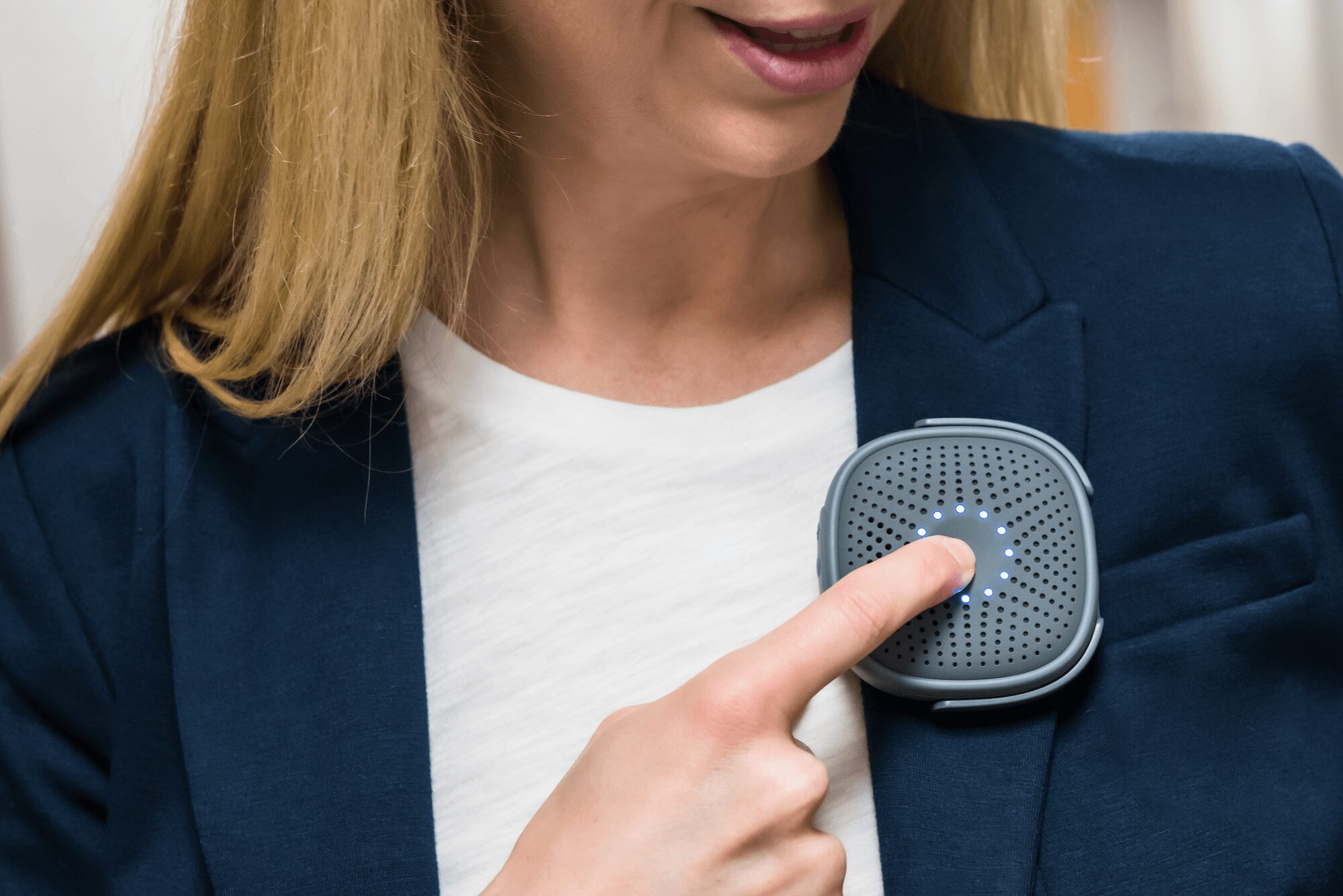 woman in blazer pressing relay AAD button