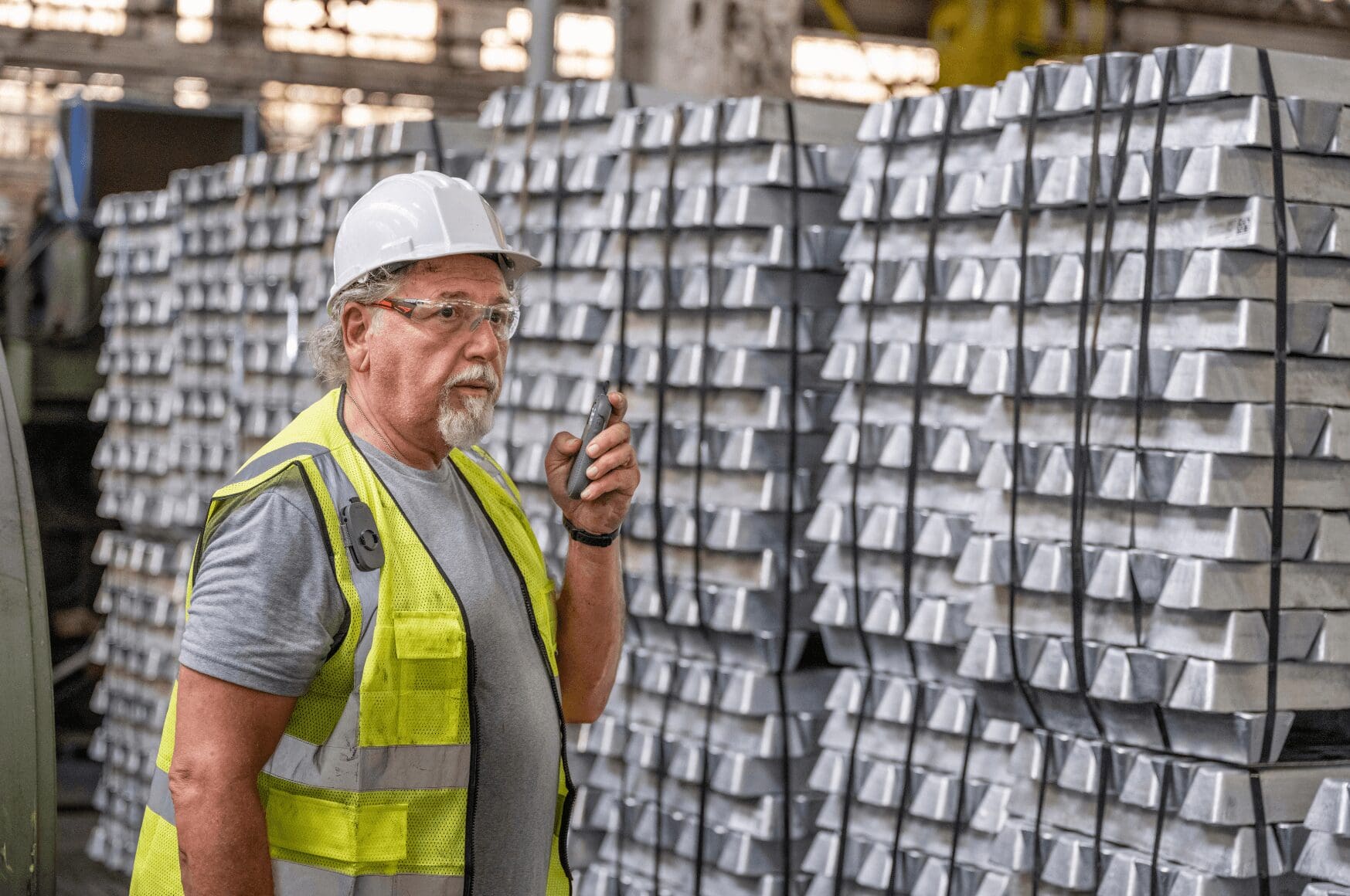 Man with smart radio in warehouse