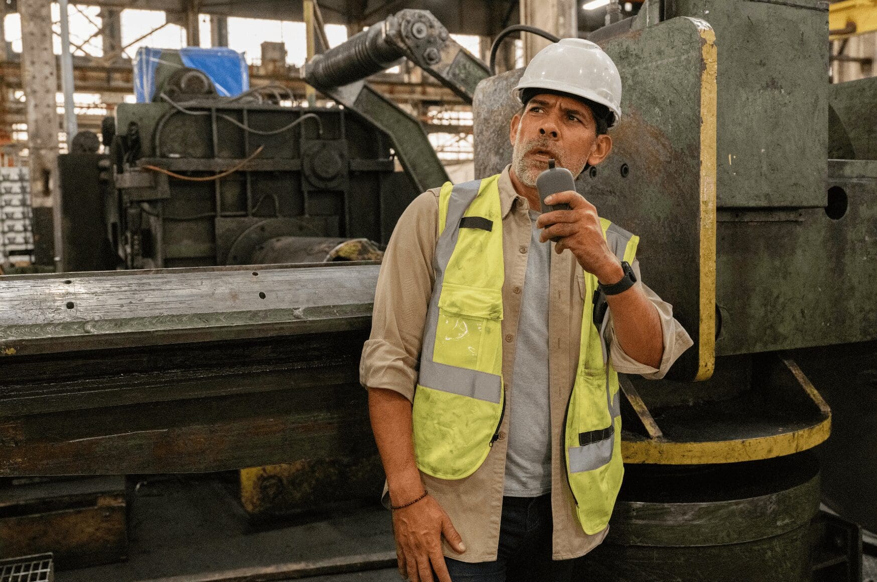Man in industrial environment using manufacturing translator device, Relay