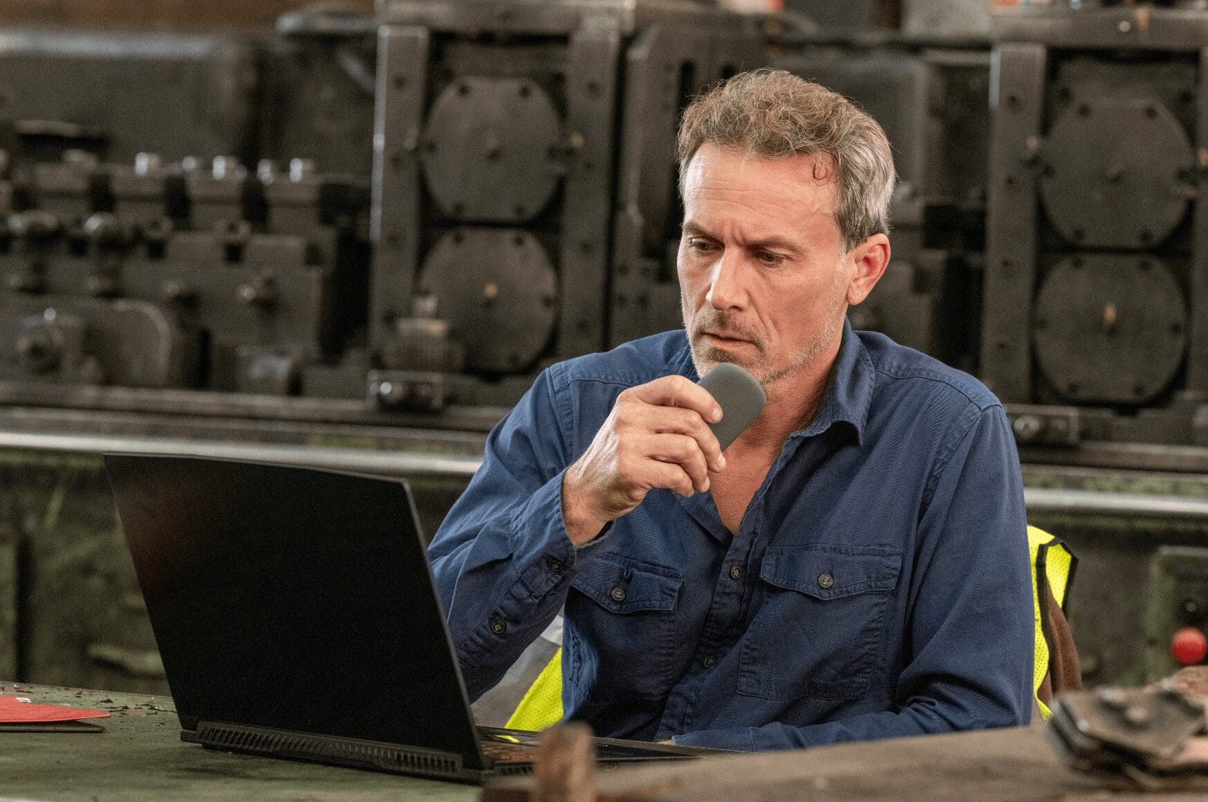 Man at desk using Relay to communicate and track his man down