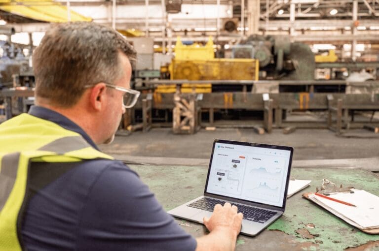 Industrial worker using Relay's dashboard in a warehouse to locate powered off Relay devices
