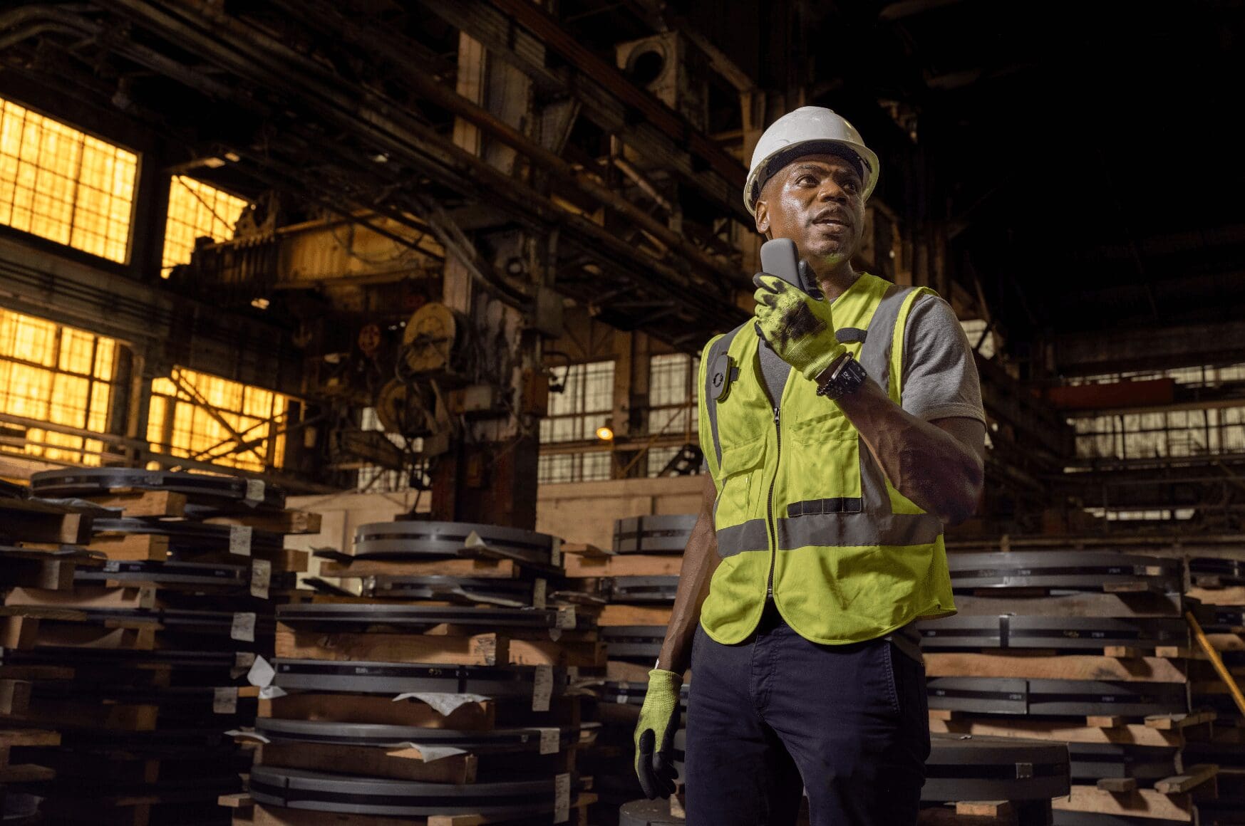 Man holding a Class 1 Division 2 Certified Radio in an Industrial Environment