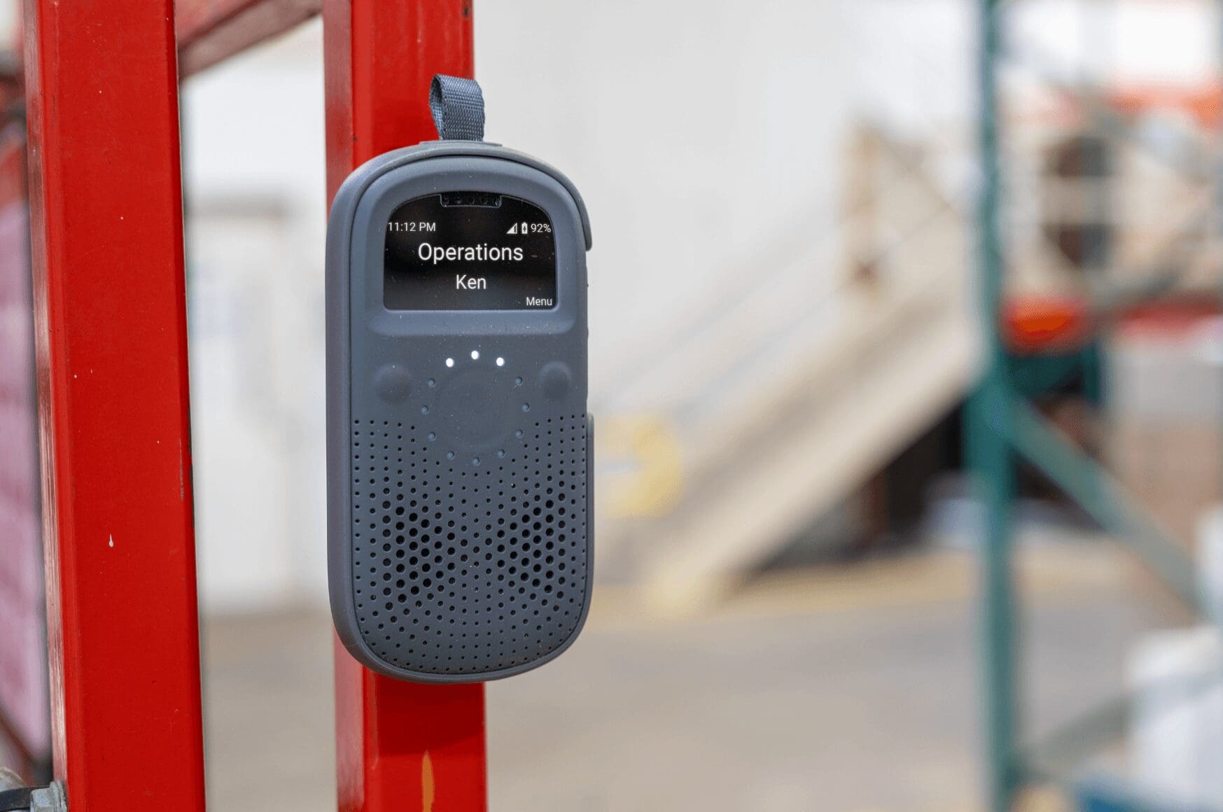 Smart walkie talkie RelayX attached to a red forklift