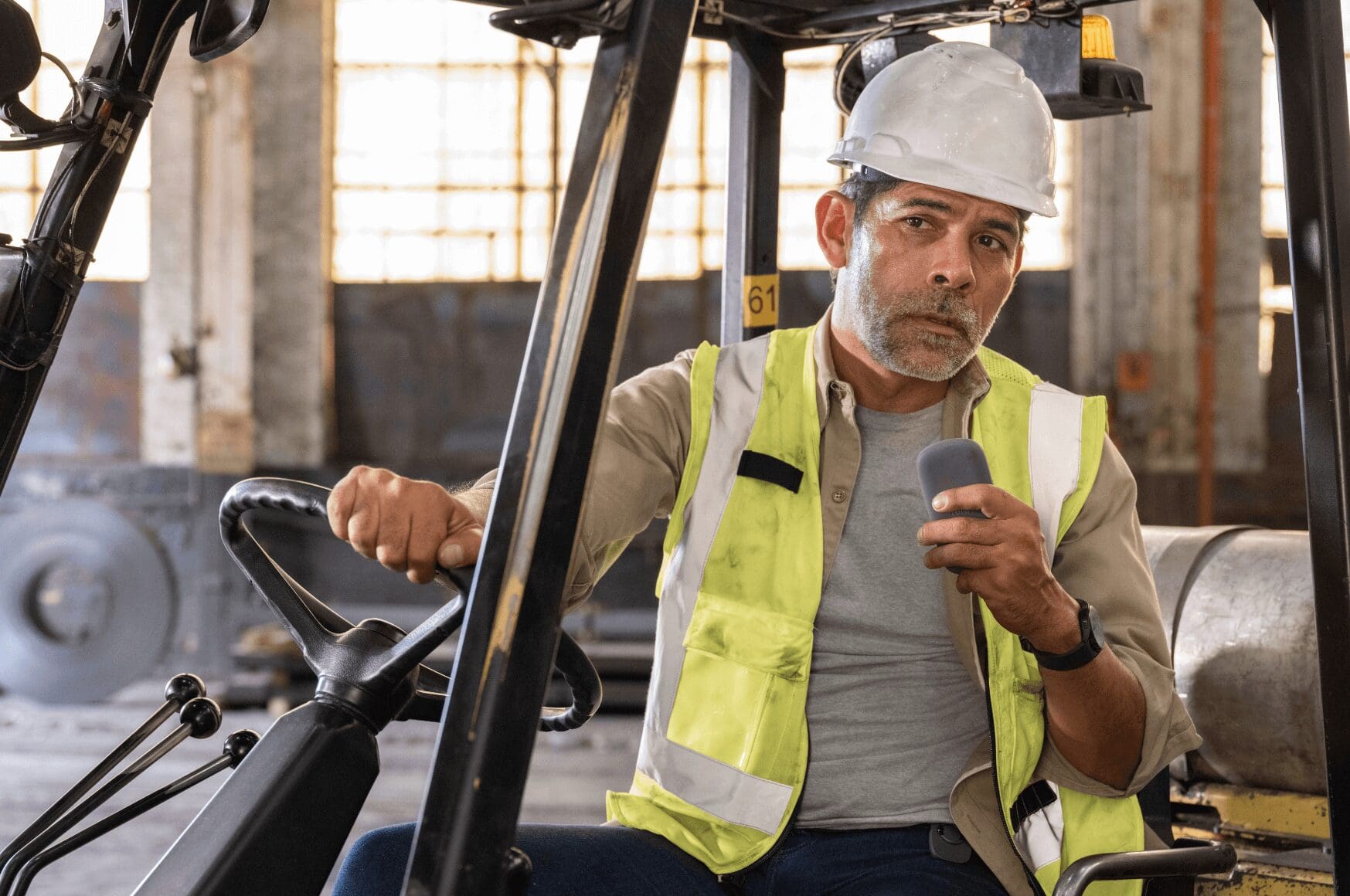 Man using RelayX for efficiency on a forklift in a warehouse