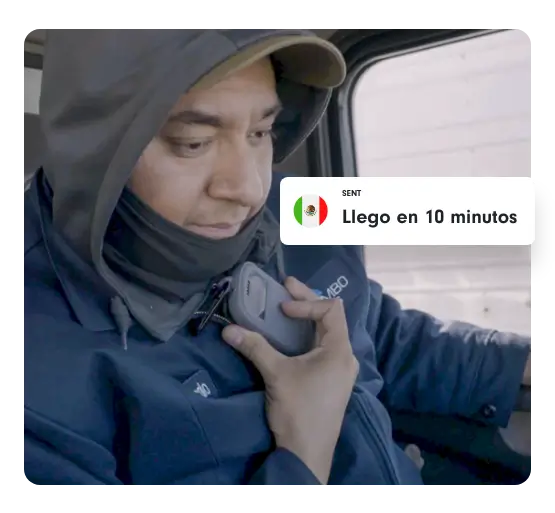 A delivery driver responds via Relay, saying “Llego en 10 minutos” from inside a truck cab.