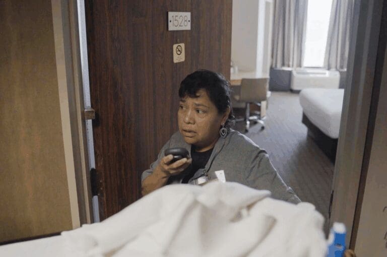 Female housekeeper using Relay as her employee safety device