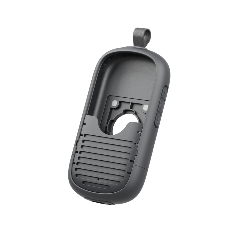 Front view of an empty dark gray RelayX Modular Case featuring a textured lower grille, internal mounting cutouts, side volume buttons, and top fabric loop.